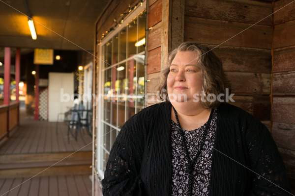 Plus Size Stock Photo: Woman in 50s with Rustic Wood Walls - Body Liberation Photos