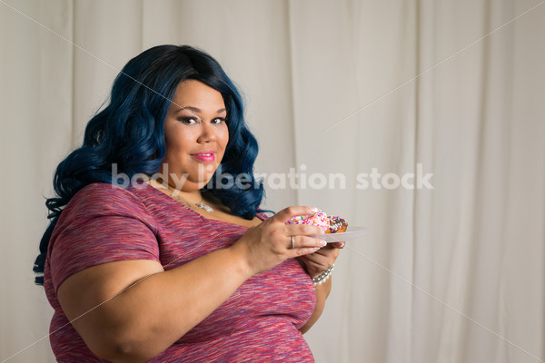 Royalty Free Stock Photo: African American Woman with Glazed Donuts - Body Liberation Photos