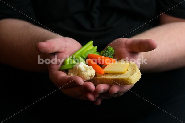 Stock Photo: Dieting Recovery Concept Man’s Hands Full of Food - Body Liberation Photos