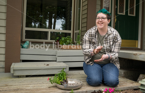 Diverse Gardening Stock Photo: Agender Person Brushes off Hands - Body Liberation Photos