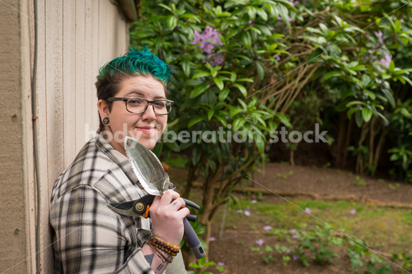 Diverse Gardening Stock Photo: Agender Person Holds Hand Tools - Body Liberation Photos