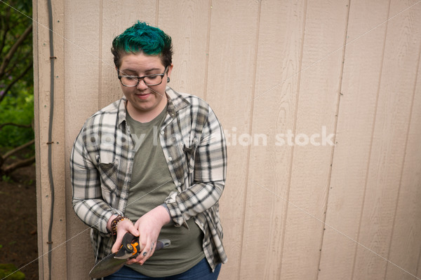 Diverse Gardening Stock Photo: Agender Person Holds Hand Tools - Body Liberation Photos