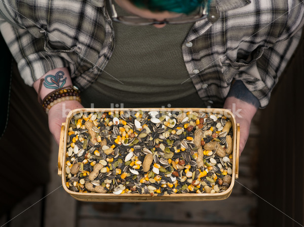 Diverse Gardening Stock Photo: Agender Person Holds Nuts and Seeds - Body Liberation Photos