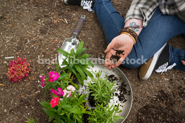 Diverse Gardening Stock Photo: Agender Person Plants Seedling - Body Liberation Photos
