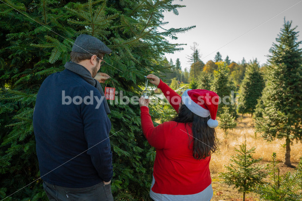 Holiday Stock Image: Plus-Size Couple at a Tree Farm - Body Liberation Photos