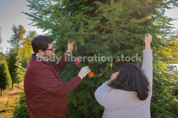 Holiday Stock Image: Plus-Size Couple at a Tree Farm - Body Liberation Photos