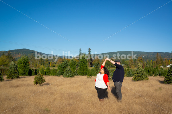 Romance Stock Image: Couple Dancing in Field - Body Liberation Photos