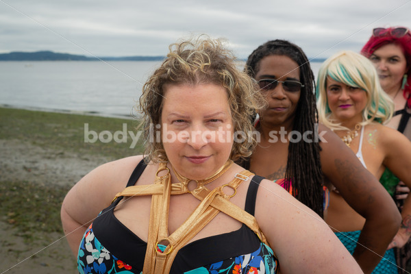 Stock Image: Group of friends walking on beach - Body Liberation Photos & Stock