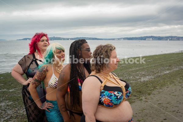 Stock Image: Group of friends walking on beach - Body Liberation Photos & Stock