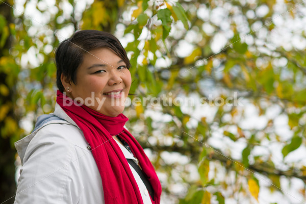Stock Photo: Young Asian American Woman with Tree Branches - Body Liberation Photos