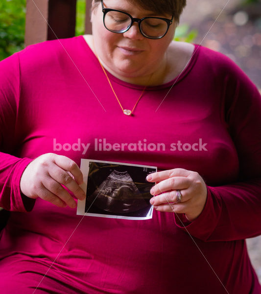 Plus Size Pregnancy Stock Photo: Pregnant Woman with Sonogram Print
