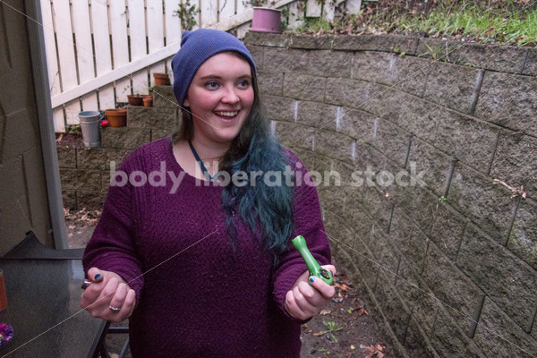 A young caucasian woman smokes legal marijuana in Washington state