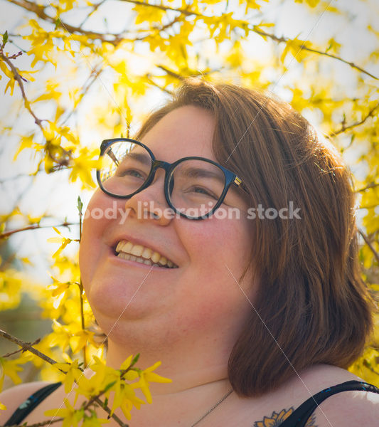 Body-Positive Stock Photo: Woman Smiling with Flowers