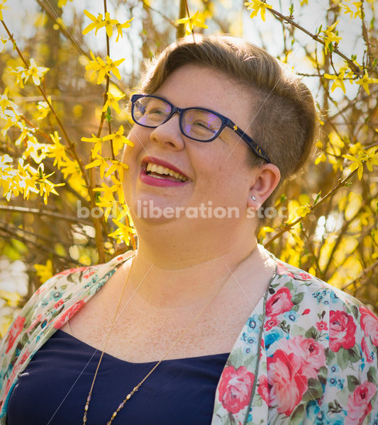 Body-Positive Stock Photo: Woman Smiling with Flowers