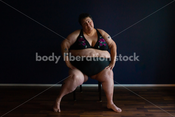 Plus Size Stock Photo: Woman in Dark Room