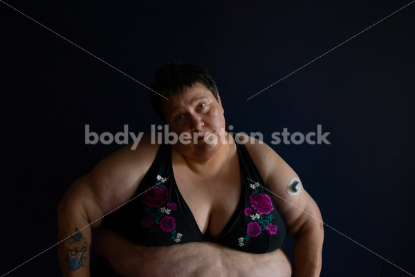 Plus Size Stock Photo: Woman in Dark Room
