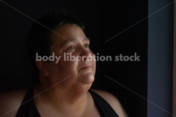 Plus Size Stock Photo: Woman in Dark Room