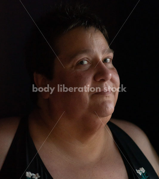 Plus Size Stock Photo: Woman in Dark Room