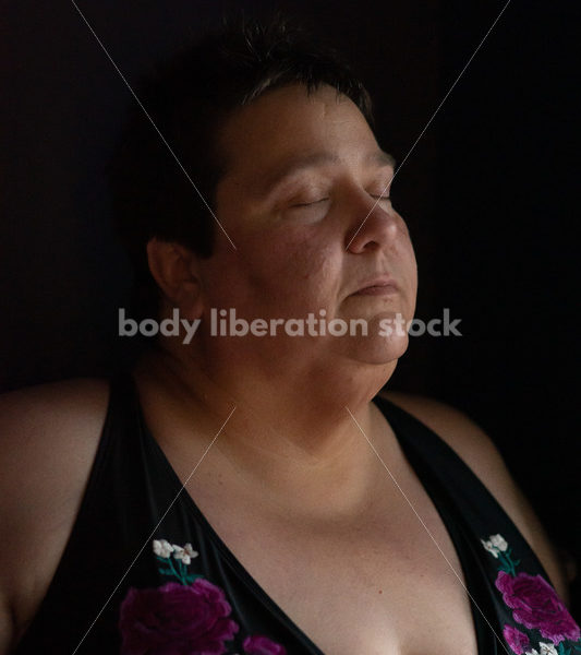 Plus Size Stock Photo: Woman in Dark Room