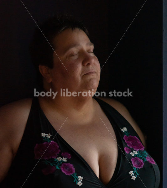Plus Size Stock Photo: Woman in Dark Room