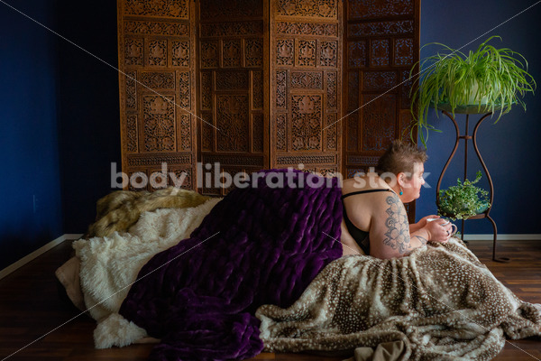 Body-Positive Stock Photo: Plus Size Woman Laying on Soft Blankets